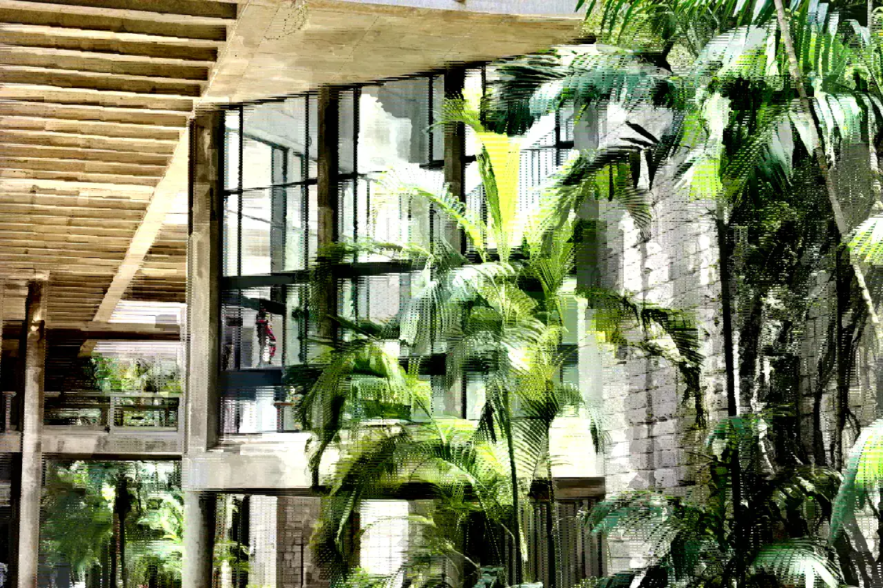 Modern school campus courtyard with clean institutional architecture.